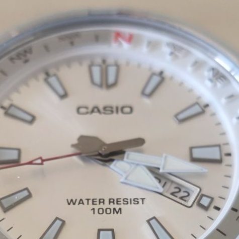 Casio MTD-130D-7A silver dial with white internal rotating compass bezel and red N marker