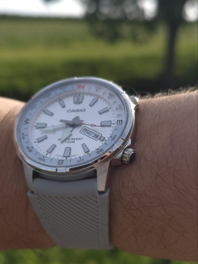 Casio MTD-130D-7A worn on the wrist, on the grey rubber strap