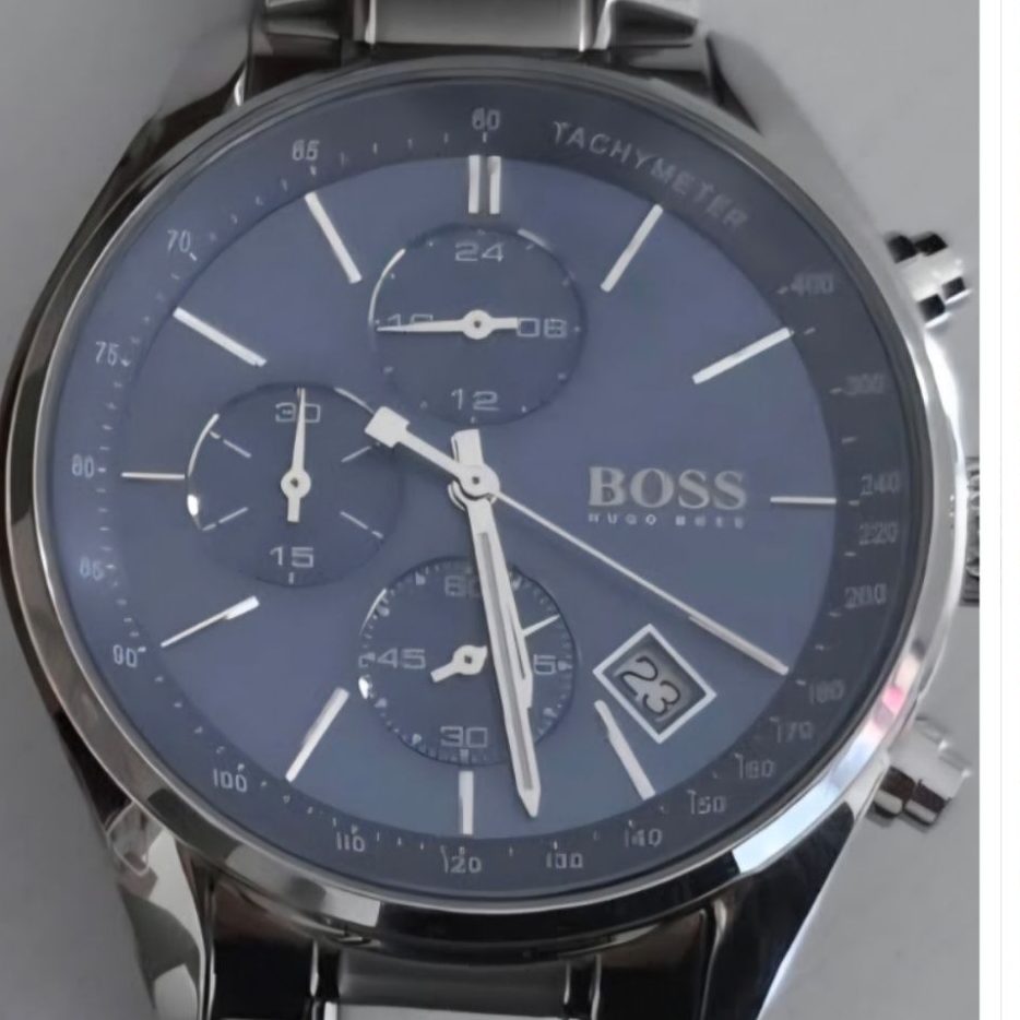 Close-up view of a Boss chronograph watch featuring a blue textured dial, subdials, and date window