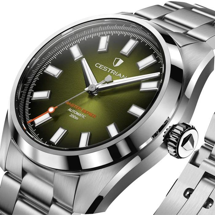 Close-up angled studio shot of the Cestrian Master Series automatic watch featuring an olive green sunburst dial, applied luminescent indices, orange accents, polished steel bezel, and stainless steel bracelet.