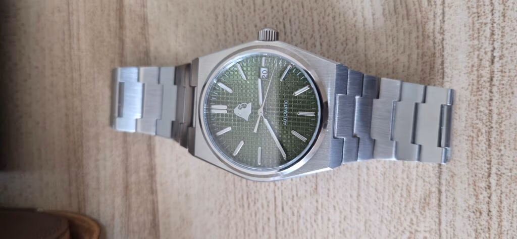 Review: Silverback Watches Interceptor Silverback Interceptor with sage green waffle dial and silver hands, photographed to show legibility of the time