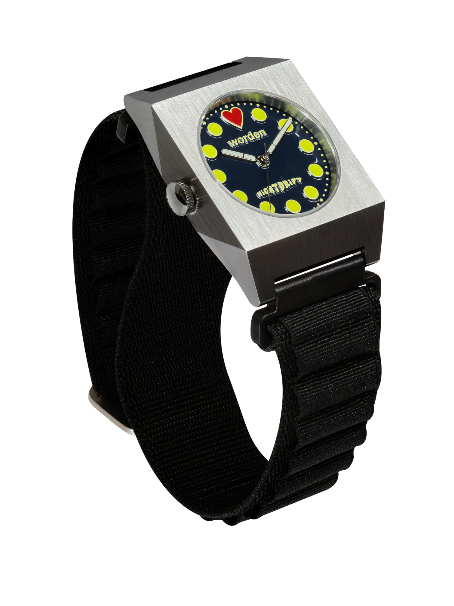 Worden Watches Angled view of a Worden Watch Studio "Nightdrift" watch featuring a geometric brushed stainless steel case, black dial with vibrant yellow dot hour markers, red heart marker at 12 o'clock, and black ribbed strap.